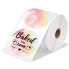 Roll of paper with 'Baked with Love' text and a heart design on a white background